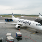 An image of a Finnair Embraer E190 aircraft waiting at Helsinki Airport