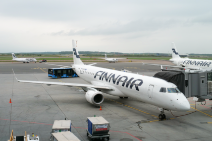 An image of a Finnair Embraer E190 aircraft waiting at Helsinki Airport