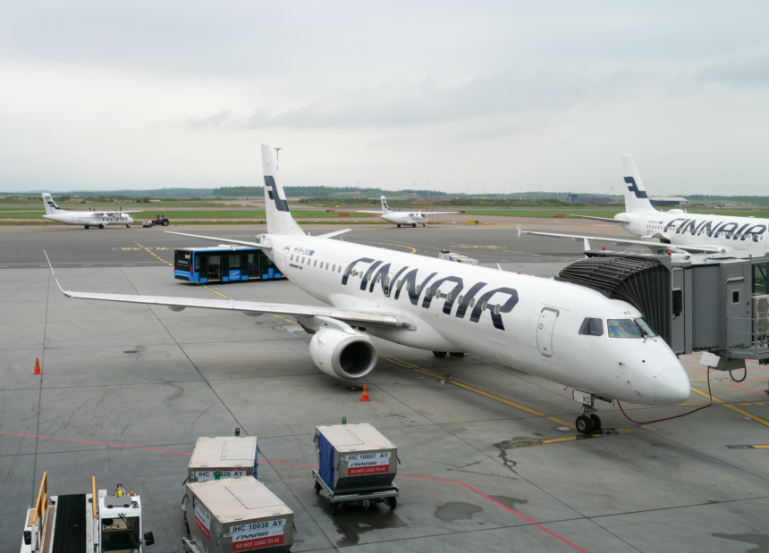 An image of a Finnair Embraer E190 aircraft waiting at Helsinki Airport