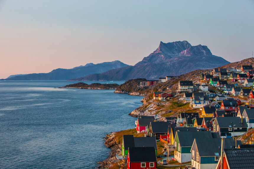 Colourful houses at sunset in the capital of Greenland, Nuuk. Mountain in the background and houses are at the right edge of the photo.