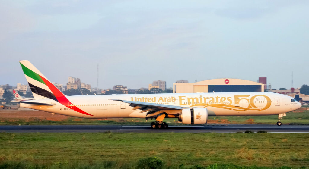 An Emirates Boeing 777-31HER with special 50th anniversary livery on the runway.