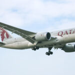 A Qatar Airways Boeing 787-8 (Dreamliner) in the air.