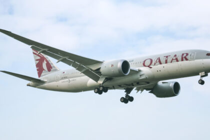 A Qatar Airways Boeing 787-8 (Dreamliner) in the air.
