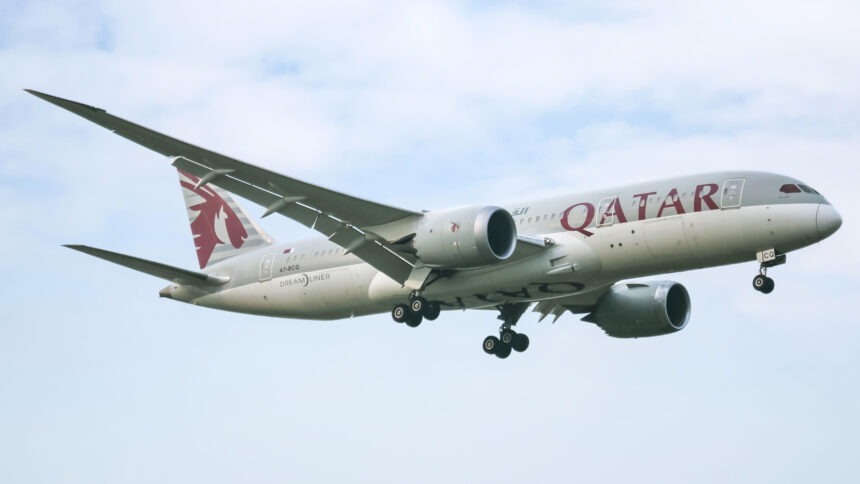 A Qatar Airways Boeing 787-8 (Dreamliner) in the air.