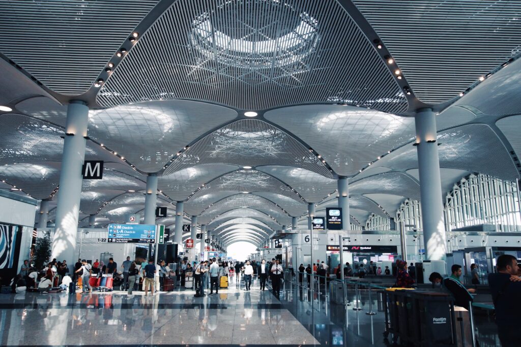 Travellers at Istanbul Airport checking in for their flight departures.