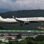 An image of a STARLUX aircraft arriving at Taipei Songshan Airport.