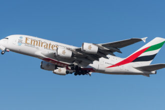 An Emirates Airbus A380-861 in the air.