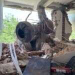 Aircraft's landing gear, inside the building along with the debris.