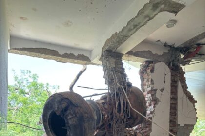 Aircraft's landing gear, inside the building along with the debris.