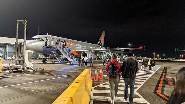 Passengers boarding aeroplane 