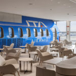 Modern lounge interior featuring ITA Airways aeroplane design.