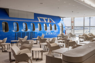 Modern lounge interior featuring ITA Airways aeroplane design.