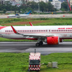An image of an Air India A320 on the runway.