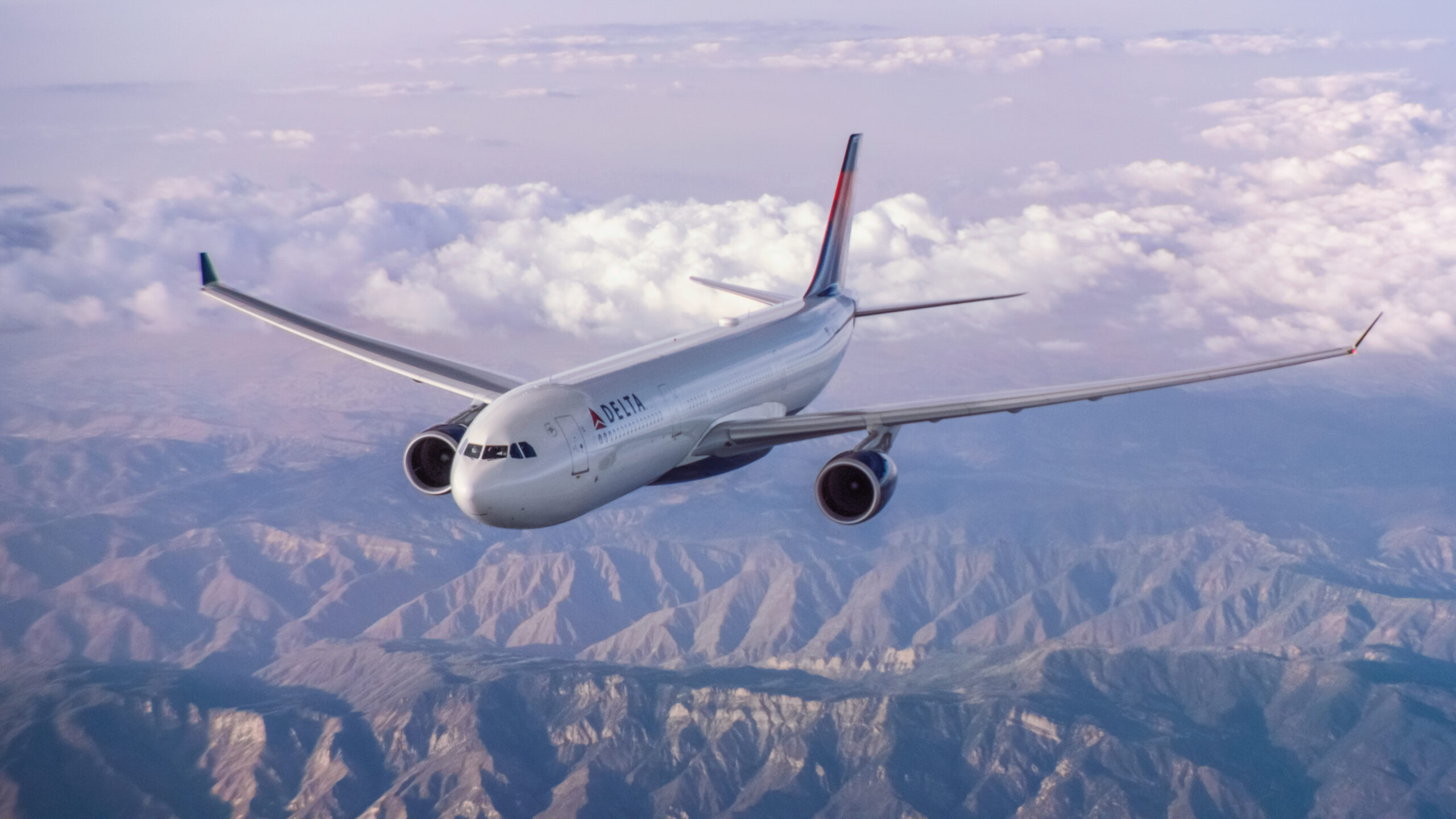 An Airbus 330-300 (333) flying over mountains