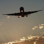 Boeing landing at sunset