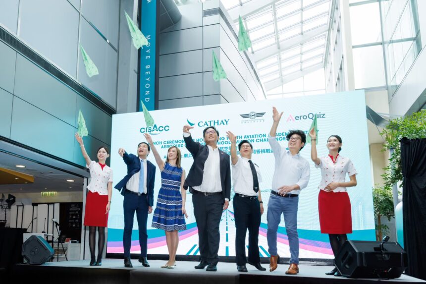 Under Secretary for Home and Youth Affairs of the Hong Kong SAR Government Clarence Leung (fourth from left), Cathay Chief Customer and Commercial Officer Lavinia Lau (third from left), HKYAA Chairman Captain Patrick Lau (third from right), Chief Flight Standards of the Civil, Aviation Department Captain Lawrence Wong (second from left), and HKYAA Honorary Advisor Albert Wong (second from right) kicked off the launch event with paper plane flying activity