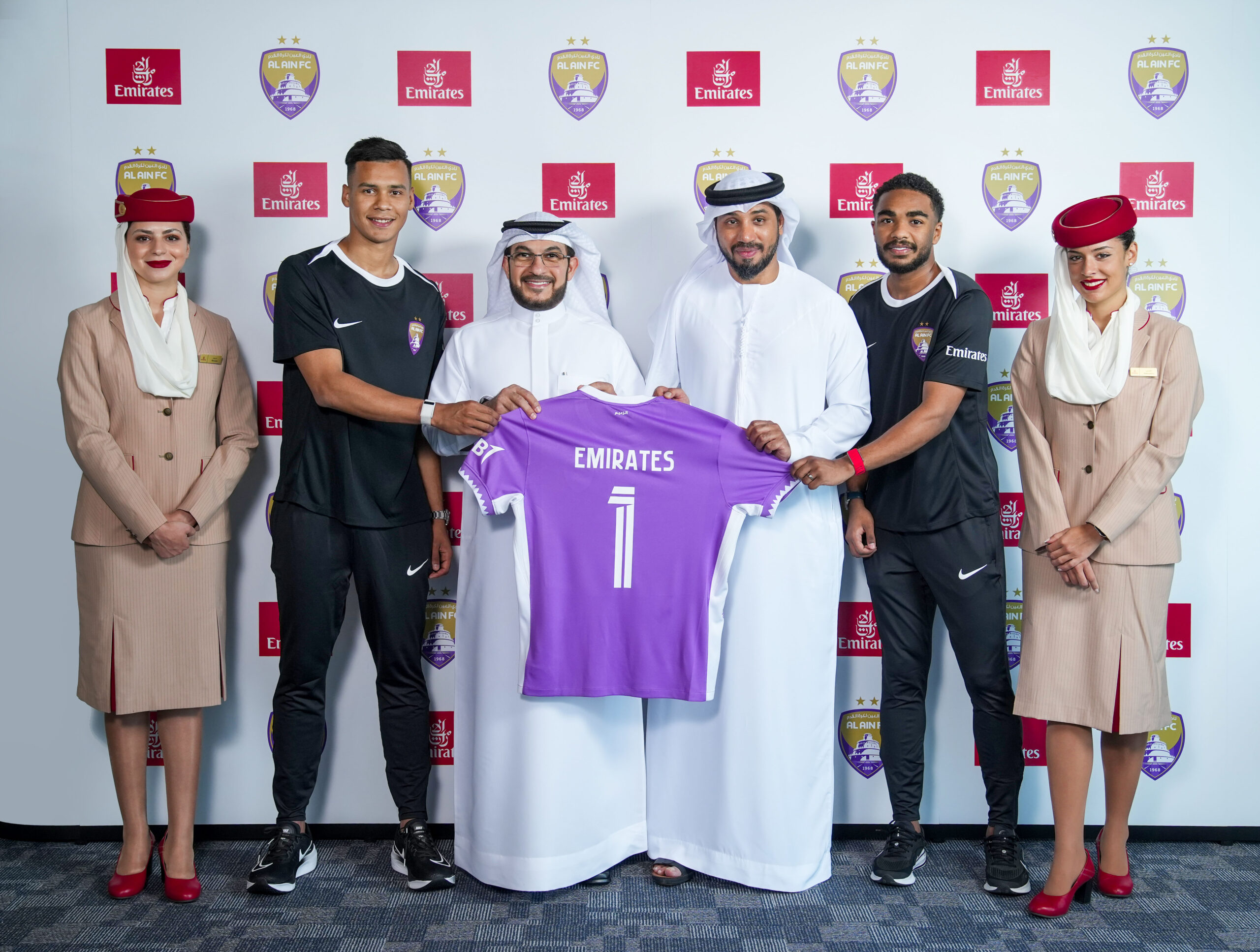 Emirates logo marketed on the sleeve and back of Al Ain's training jersey.