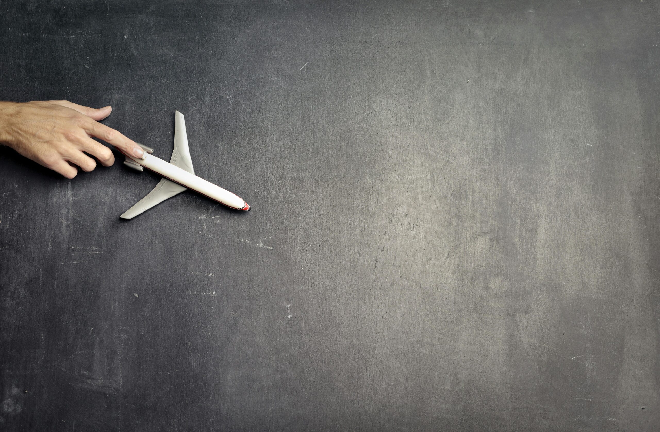 Model plane on a chalkboard