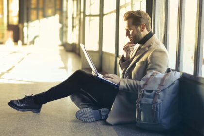 Brown Haired Man Using Laptop Computer