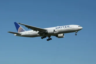 A photo of a United Airlines Airplane mid-flight