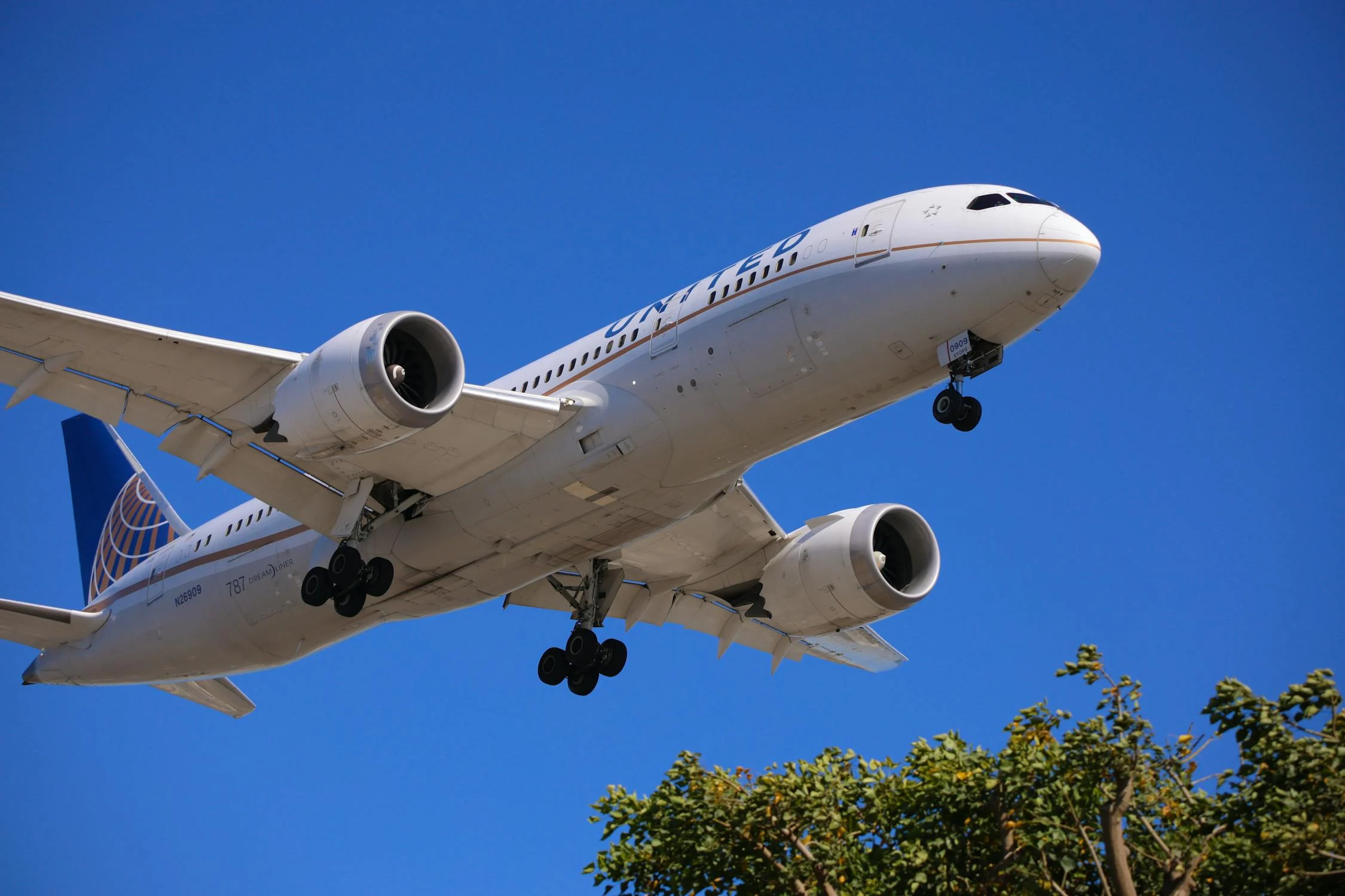 A photo of a United Airlines airplane flying