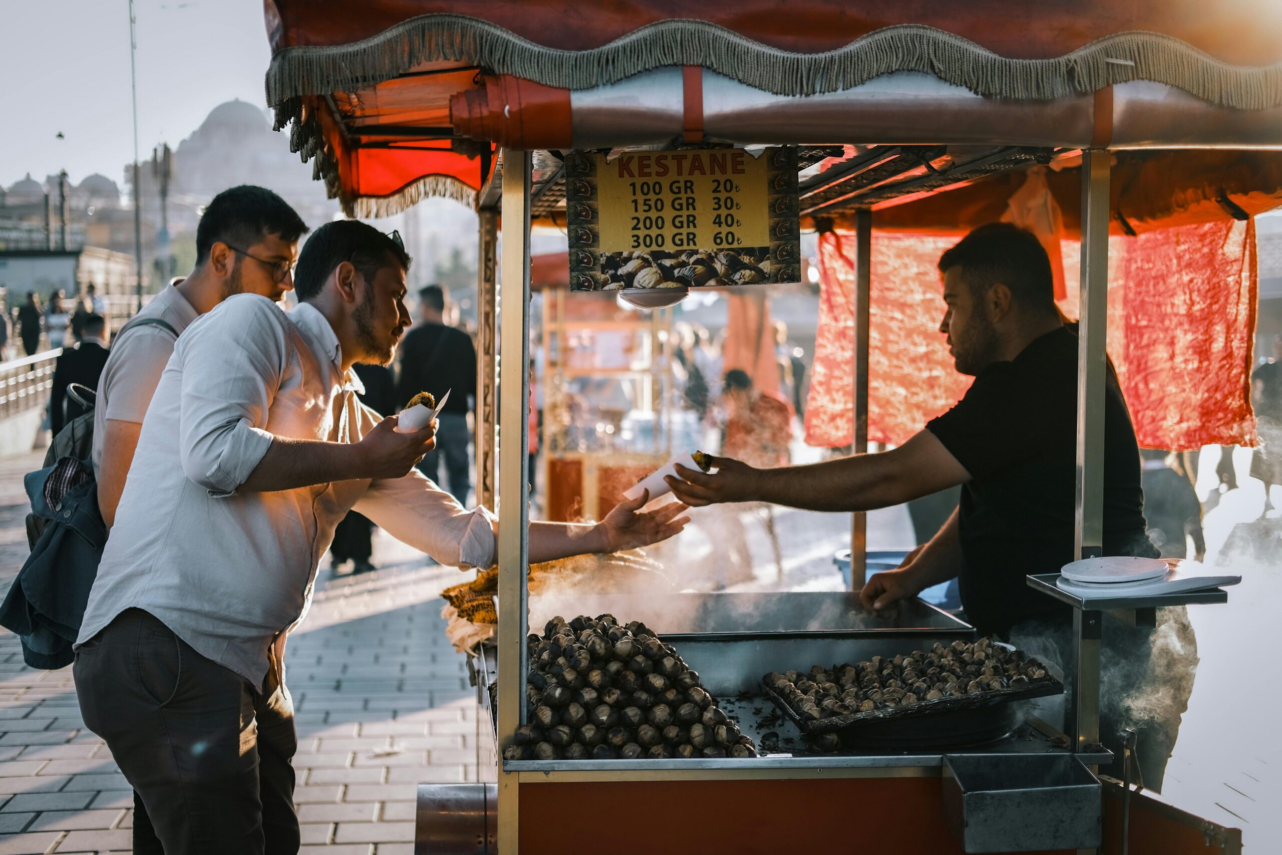 A man buying chestnuts at a streetmarket in Istanbul