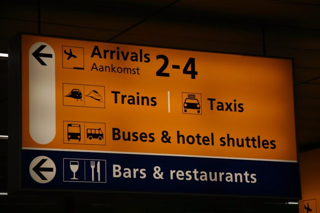 Yellow signage at Schiphol Airport. 