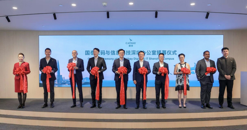 Cathay Group Chief Executive Officer Ronald Lam (fifth from left), Cathay Director Chinese Mainland Arnold Cheng (fifth from right), Cathay Director Digital and IT Lawrence Fong (fourth from left), Cathay General Manager Chinese Mainland Commercial and Operations Martin Xu (fourth from right), Cathay General Manager IT Solutions Annie Ling (third from right), Cathay General Manager IT Infrastructure and Security Rajeev Nair (second from right), Cathay General Manager Digital Ventures Navin Chellaram (third from left) and Cathay General Manager Digital Aldric Chau (second from left) marked the opening of Cathay's new Shenzhen IT office with a ribbon-cutting ceremony.