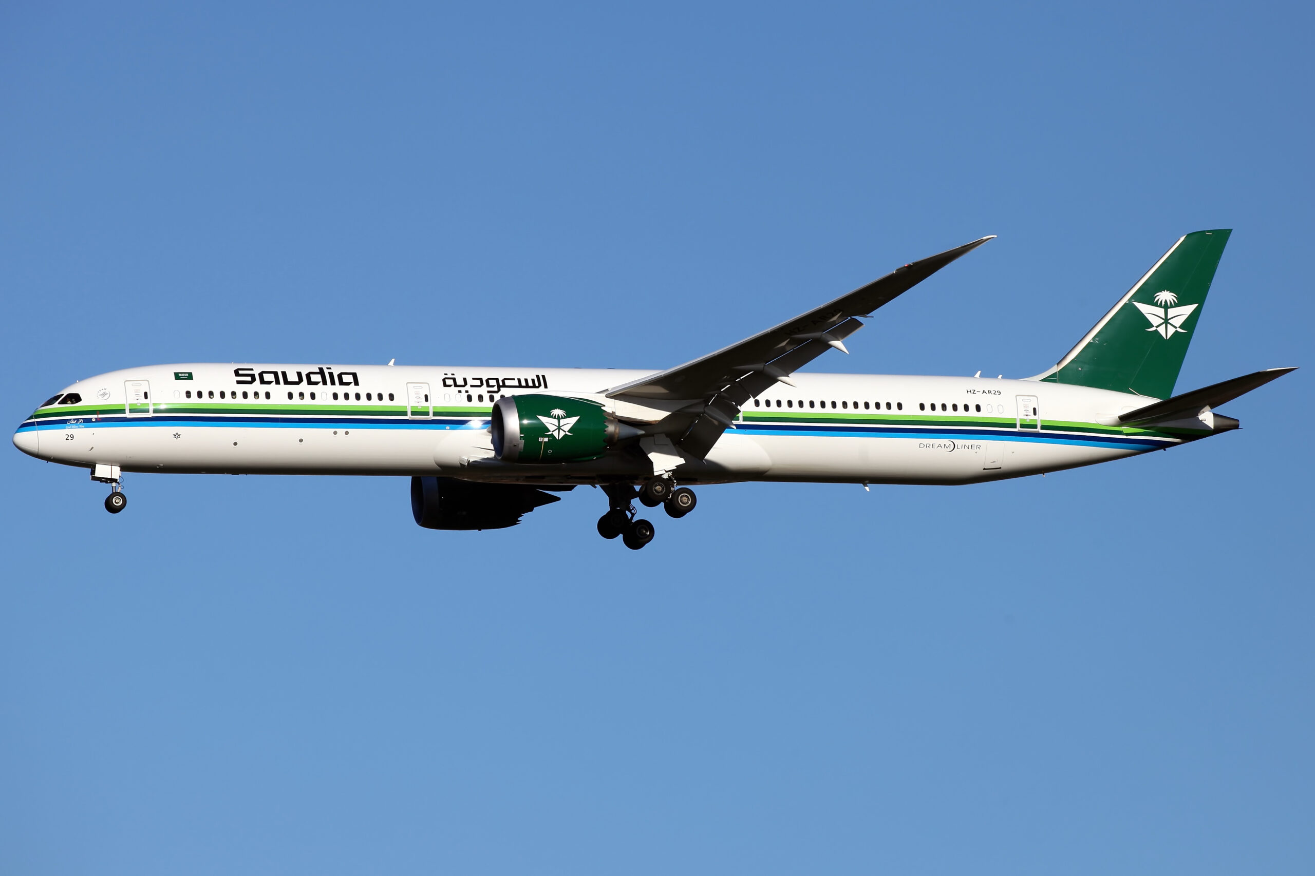 A Saudia Boeing 787-10 in the air above London Heathrow.