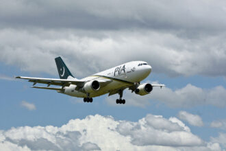 A PIA Airbus A310 in air.