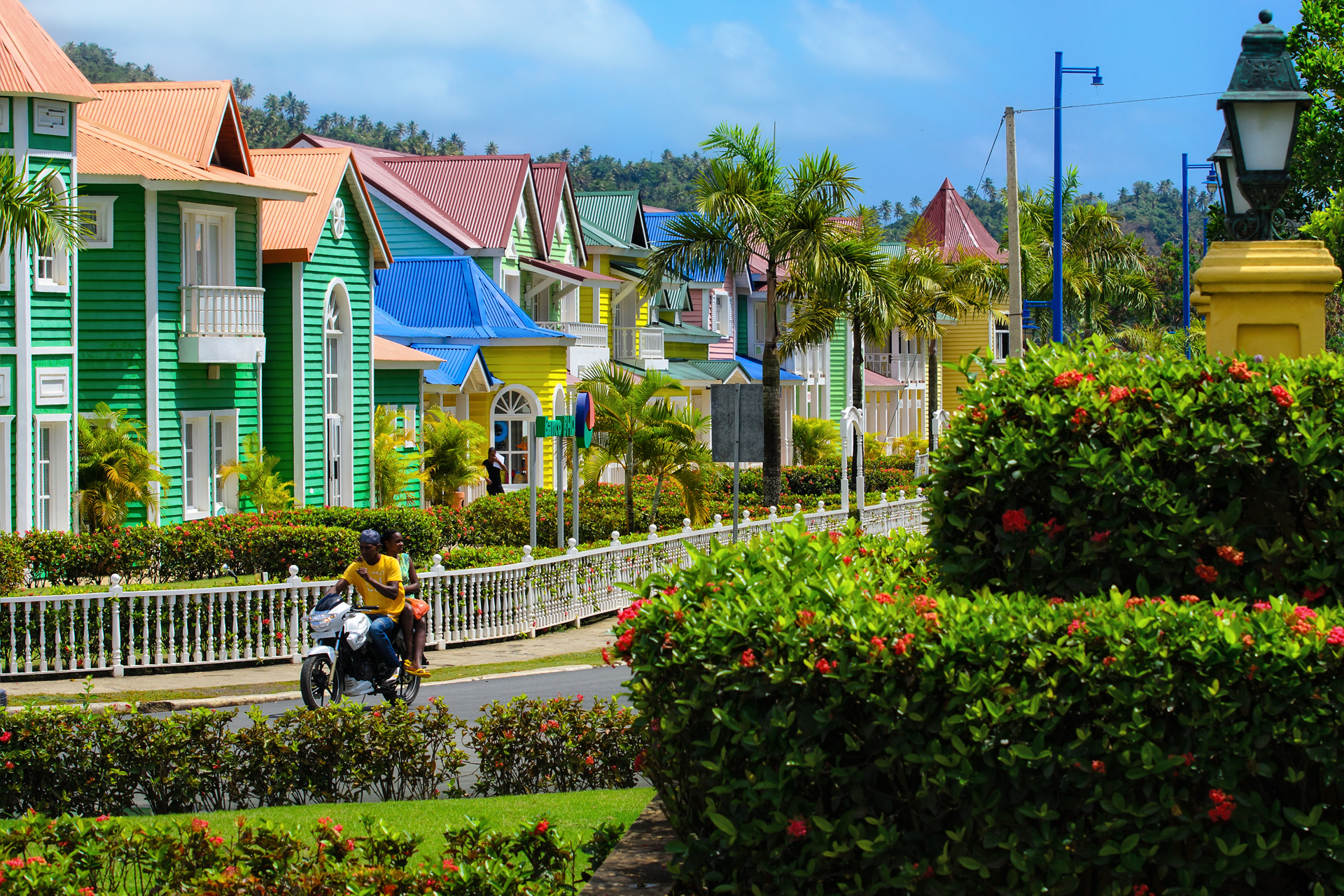 A view of some brightly coloured houses on a street in Samaná, Dominican Republic.