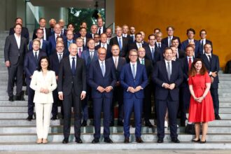German Chancellor Friedrich Merz, Siemens CEO Roland Busch, Deutsche Bank CEO Christian Sewing and other leaders at the Federal Chancellery launching the Made for Germany initiative.