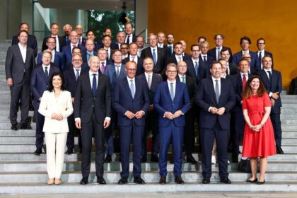 German Chancellor Friedrich Merz, Siemens CEO Roland Busch, Deutsche Bank CEO Christian Sewing and other leaders at the Federal Chancellery launching the Made for Germany initiative.