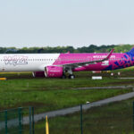 An Airbus A321-271NX of WizzAir Abu Dhabi on the ground at an airport.