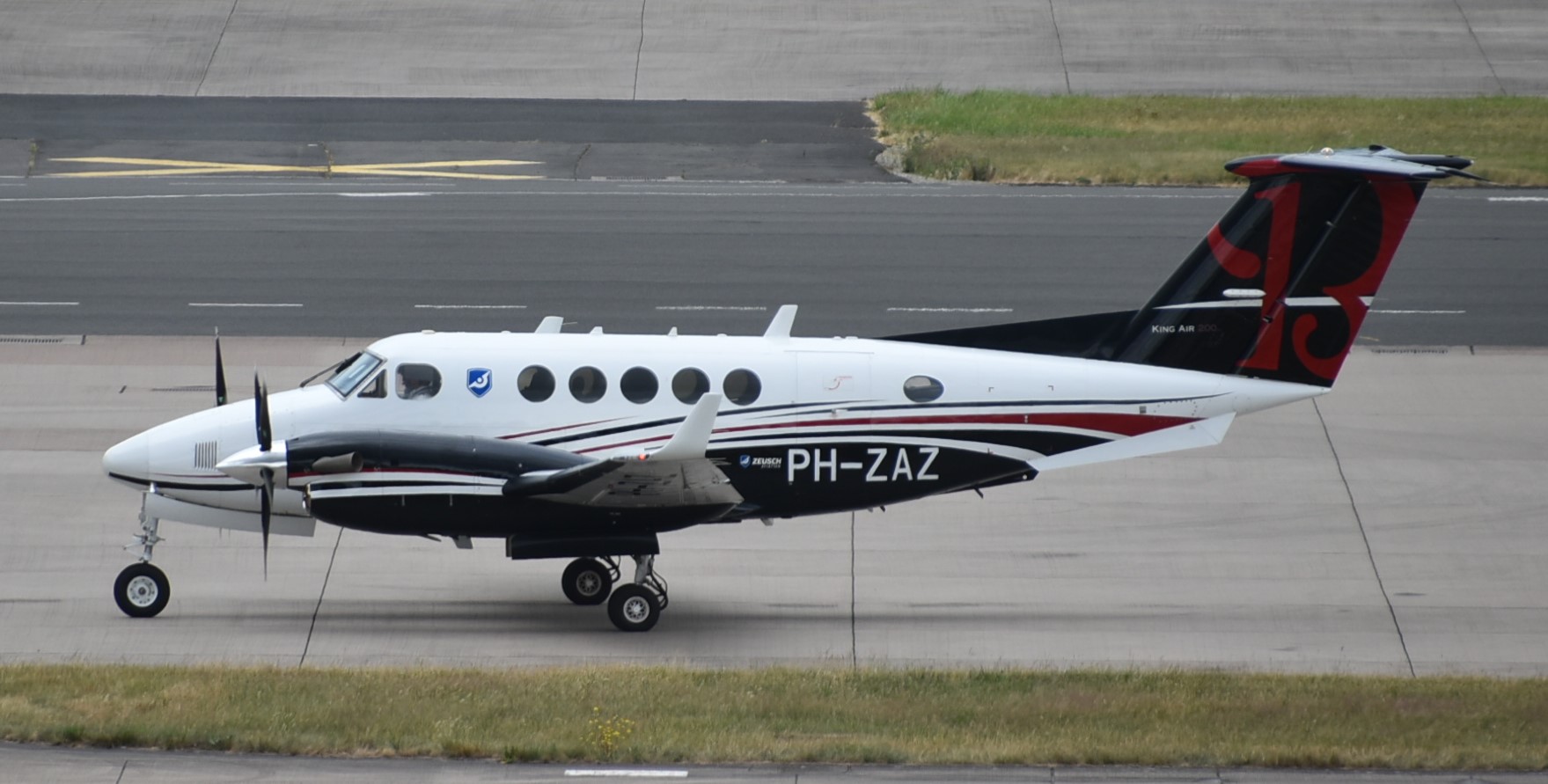 A Zeusch Aviation Beech B200 Super King Air plane at Birmingham Airport