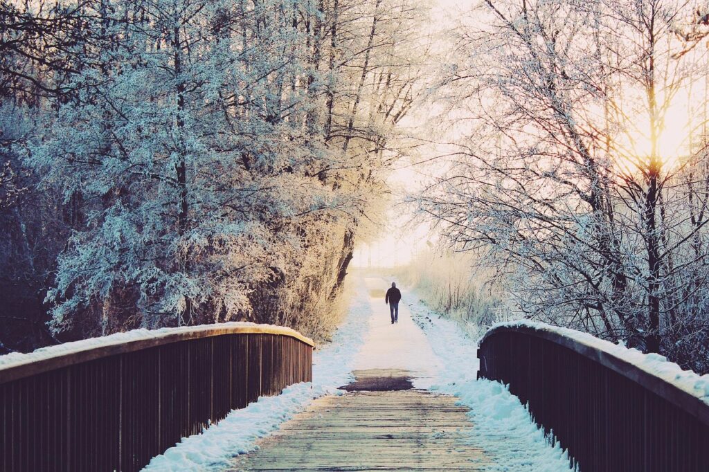 A man walking in snowy weather