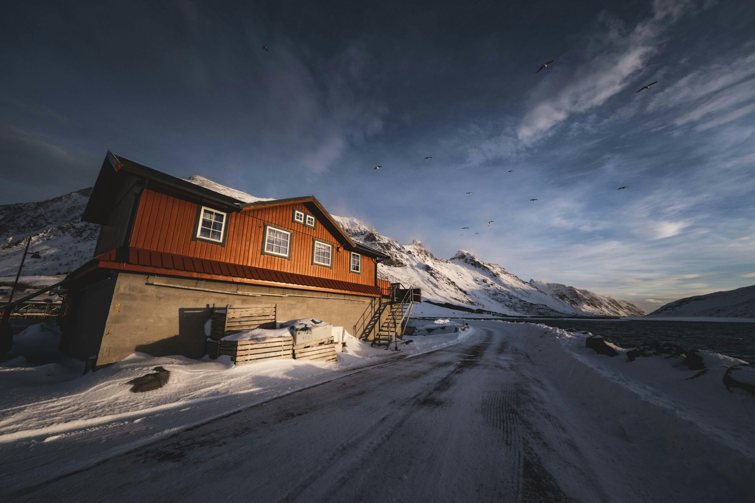 Scenic Winter Cabin in Snowy Mountain Landscape