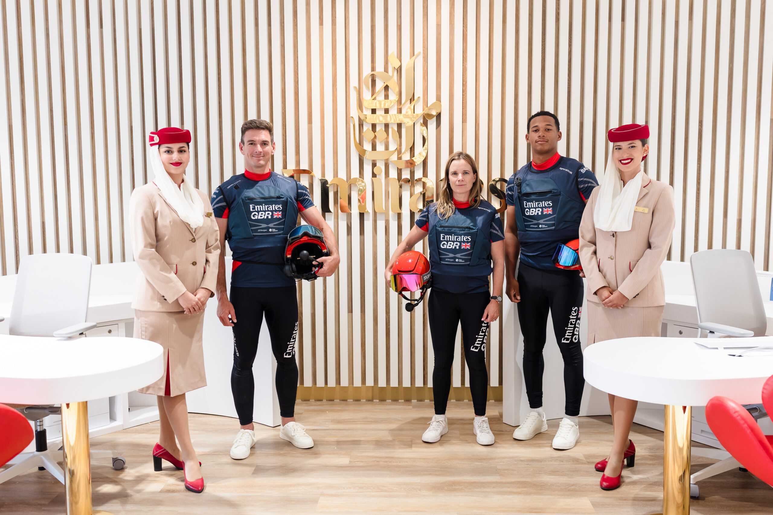Emirates GBR team members with Emirates cabin crew - From left to right: Dylan Fletcher, Hannah Mills, and Kai Hockley