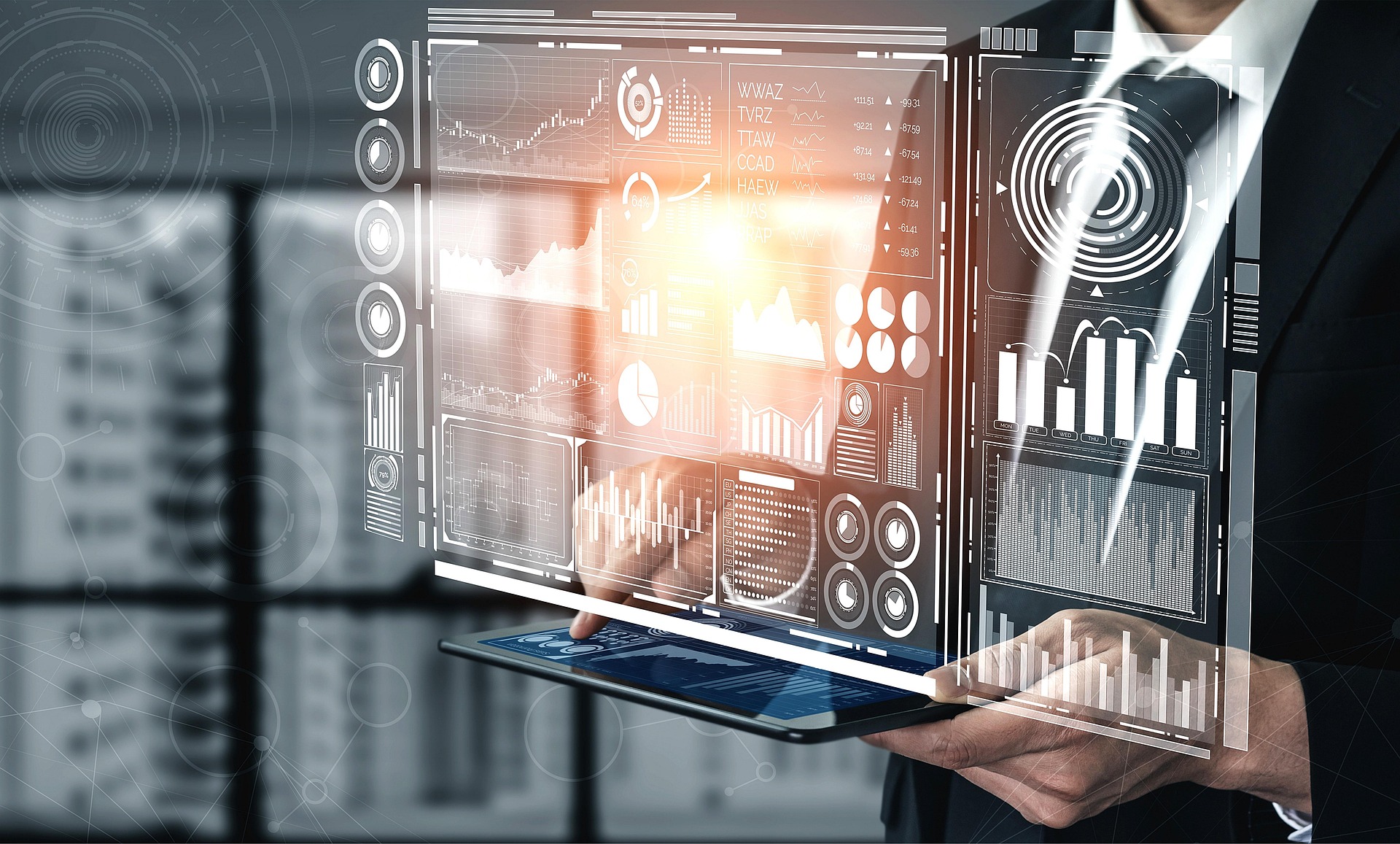 Person using a digital tablet with virtual data and analytics dashboards projected above it. Artifical Intelligence (AI)