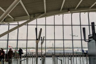 London Heathrow Airport (LHR) interior view, windows showing outside.