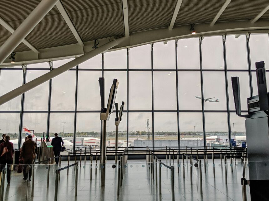 London Heathrow Airport (LHR) interior view, windows showing outside.
