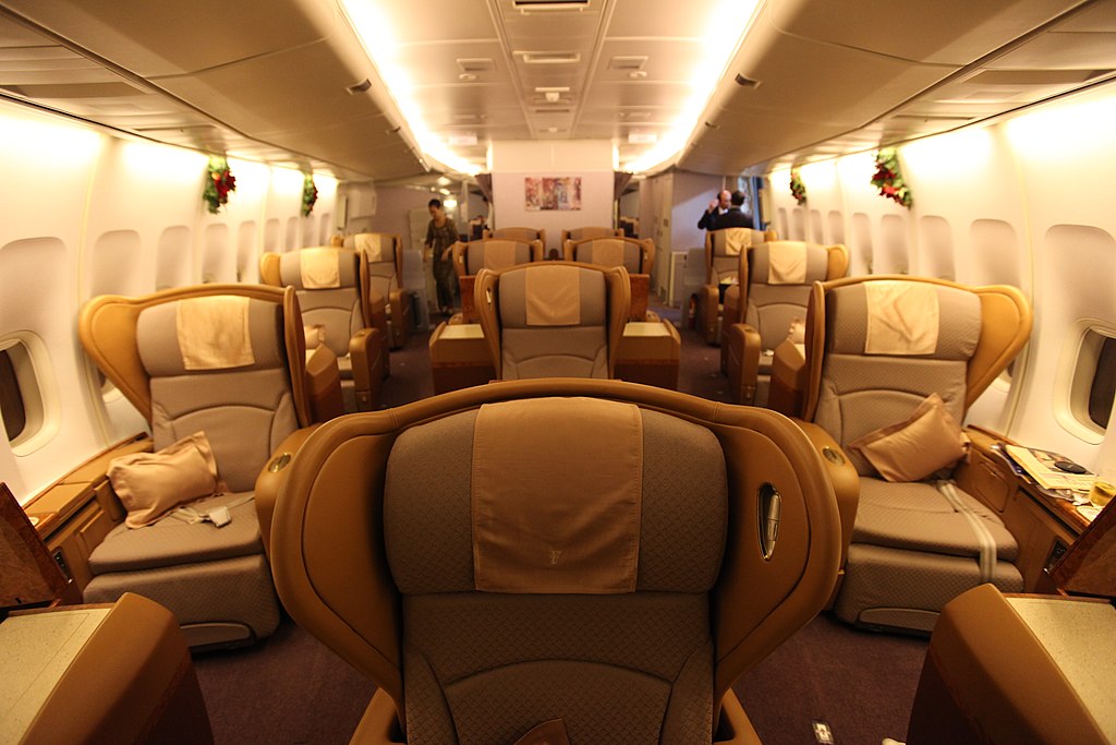 A spacious first-class cabin offering luxury, comfort, and privacy in the skies