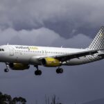 A Vueling A320 aircraft in air.