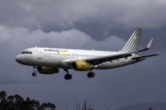 A Vueling A320 aircraft in air.