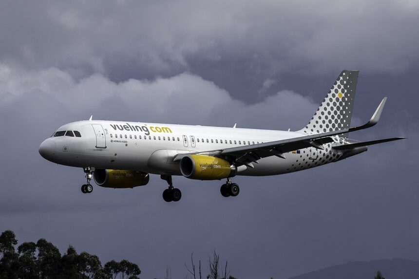 A Vueling A320 aircraft in air.