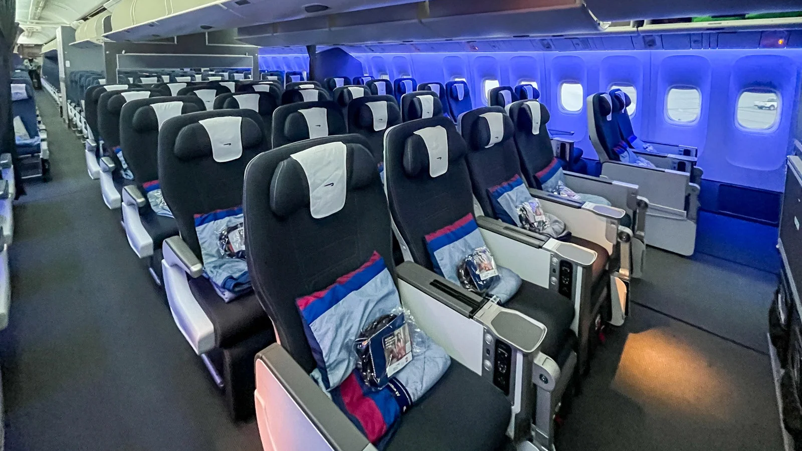 British Airways premium economy cabin showcasing wider seats, extra legroom, and added comforts designed to enhance the long-haul flying experience