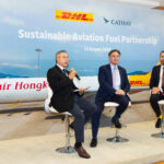 Representatives from DHL Express and Cathay Pacific Group at the deal signing event.