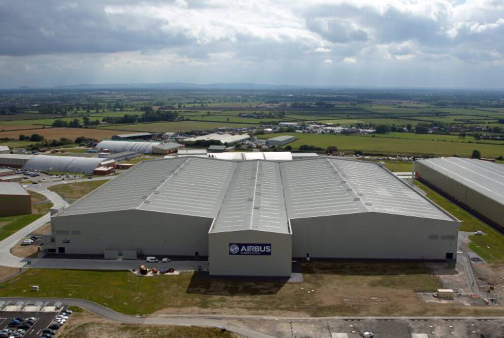Aerial view of Airbus’ A350 XWB wing factory in Broughton, Wales, UK. Illustrating Airbus UK workers strike and Airbus industrial action across UK sites amid Airbus pay dispute and ongoing Airbus strike affecting UK aviation.