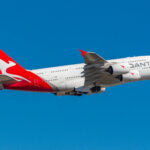 A Qantas A380 wide body aircraft in the air.