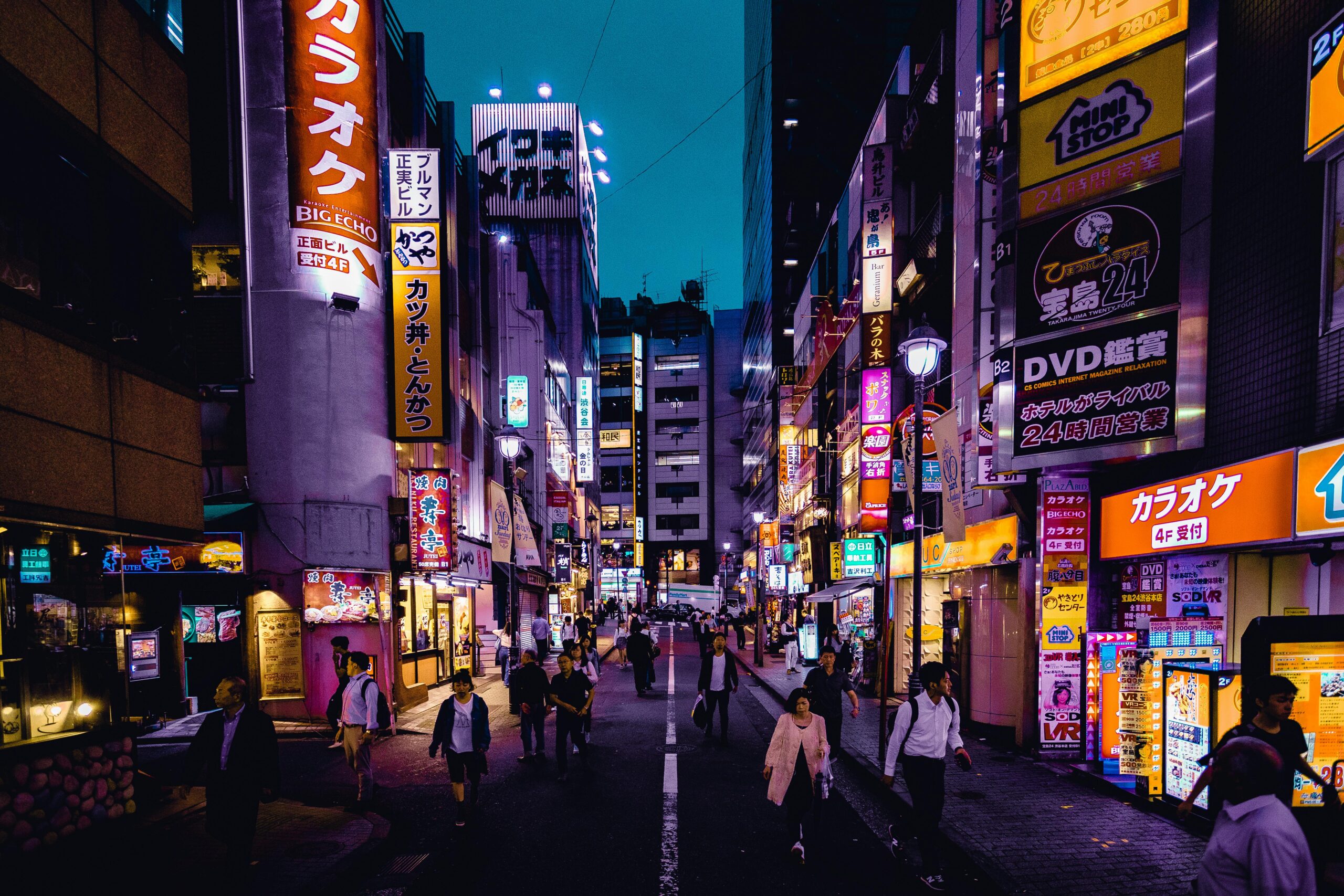 People Walking On The Streets Surrounded By Buildings